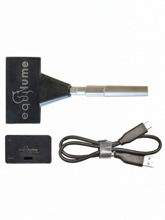 Equilume Smart Key, Equilume Pro Wireless Charging Pad and Equilume Charging Cable photographed on a blank white background