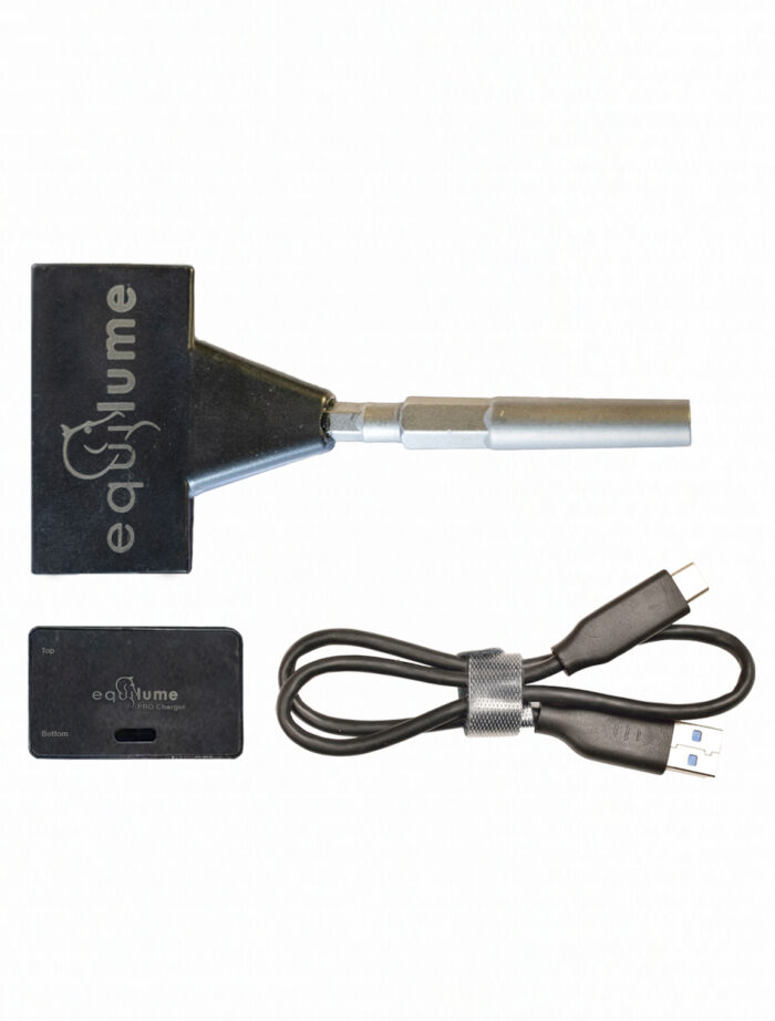 Equilume Smart Key, Equilume Pro Wireless Charging Pad and Equilume Charging Cable photographed on a blank white background